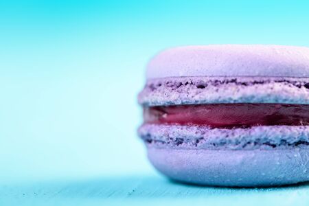Purple Lemon French Macaroon On Blue Backgroundの写真素材