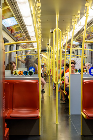 VIENNA, AUSTRIA - AUGUST 29, 2015: People Travel By Subway Train In Downtown Vienna.のeditorial素材