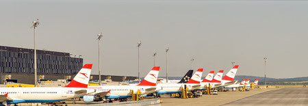 VIENNA, AUSTRIA - AUGUST 12, 2015: Austrian Airlines is the flag carrier of Austria and subsidiary of Lufthansa Group and the airline is headquartered in the grounds of Vienna International Airport.のeditorial素材