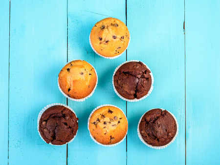 Homemade Chocolate Chip Muffins On Blue Tableの写真素材