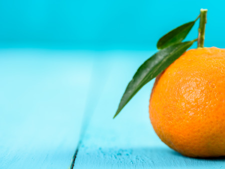 Fresh Tangerine On Blue Tableの写真素材