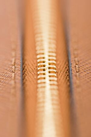 Zipper Closeup On Brown Leather Walletの写真素材
