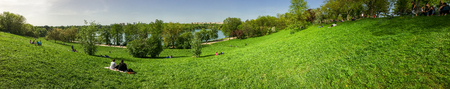 BUCHAREST , ROMANIA - APRIL 17, 2016: Panorama View Of People Relaxing And Having Picnic In Youths...