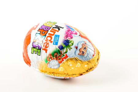 BUCHAREST, ROMANIA - JANUARY 05, 2016: Kinder Surprise Chocolate Eggs are a confection manufactured by Ferrero company and has the form of a chocolate egg containing a small toy.のeditorial素材