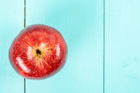 Fresh Red Delicious Apple On Turquoise Wood Tableの写真素材