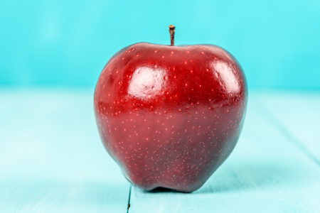 Fresh Red Delicious Apple On Turquoise Wood Tableの写真素材