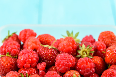 Raspberry And Strawberry Pile In Fruit Marketの写真素材