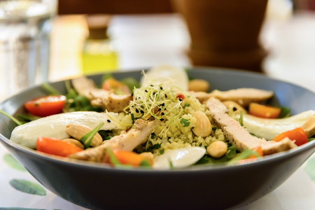 Fresh Salad With Mozzarella, Chicken, Tomatoes, Almonds And Onion Germsの写真素材