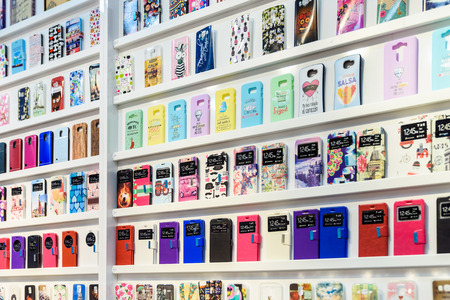 VALENCIA, SPAIN - JULY 23, 2016: Colorful iPhone And Samsung Phone Cases For Sale In Mobile Phones Stores.のeditorial素材