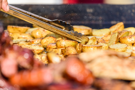 Preparing Grilled Potatoes On Barbecueの写真素材