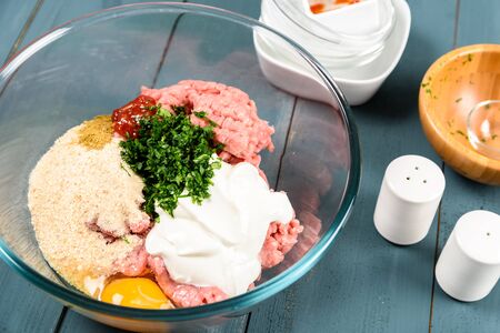 Food Ingredients For Preparing Meatballs On Kitchen Table
