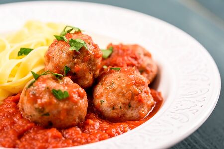 Italian Tagliatelle Pasta With Harissa Turkey Meatballsの写真素材