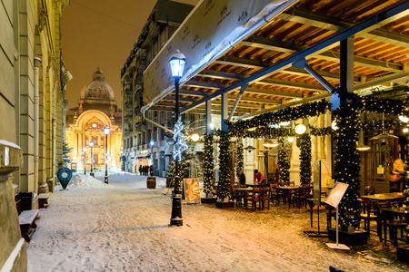 BUCHAREST, ROMANIA - JANUARY 06, 2017: CEC Bank (Casa de Economii si Consemnatiuni) During Winter Snow Storm In Downtown Bucharest At Night.のeditorial素材