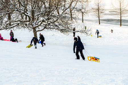 BUCHAREST, ROMANIA - JANUARY 11, 2017: Children Playing With Snow After Snowfall On Winter Day In...