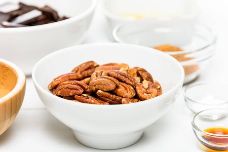 Pecan Nuts In White Bowl On Tableの写真素材