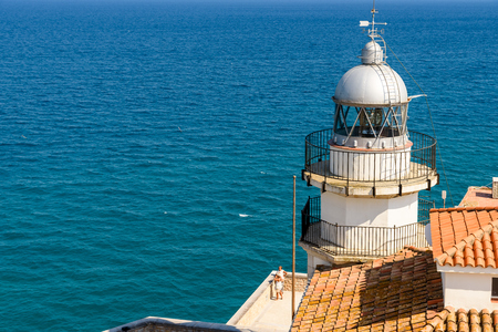 PENISCOLA, SPAIN - JULY 28, 2016: Lighthouse Of Peniscola Papa Luna Castle With Mediterranean Sea As Background.のeditorial素材