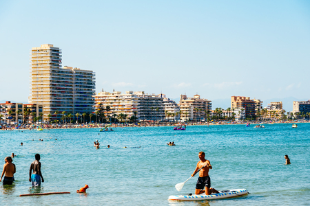 VALENCIA, SPAIN - JULY 28, 2016: People Having Fun In Water And Relaxing In Peniscola Beach Resort At Mediterranean Sea In Spain.のeditorial素材