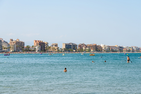 VALENCIA, SPAIN - JULY 28, 2016: People Having Fun In Water And Relaxing In Peniscola Beach Resort At Mediterranean Sea In Spain.のeditorial素材