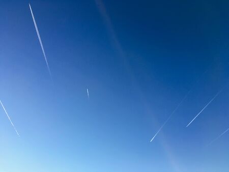 Airplane Trails On Blue Skyの写真素材
