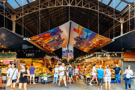 BARCELONA, SPAIN - AUGUST 05, 2016: People In Barcelona Market (Mercat de Sant Josep de la Boqueria), a large public market and a tourist landmark with entrance from La Rambla street.のeditorial素材