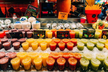 BARCELONA, SPAIN - AUGUST 05, 2016: Fresh Natural Fruit Juice For Sale In Barcelona Market (Mercat de Sant Josep de la Boqueria), a large public market with entrance from La Rambla street.のeditorial素材