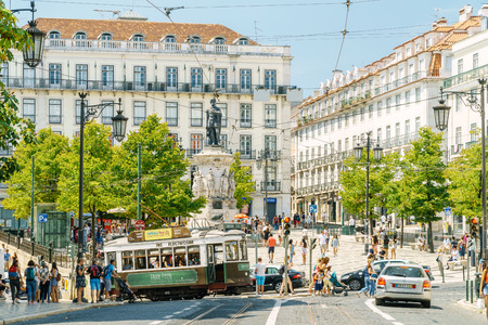 LISBON, PORTUGAL - AUGUST 11, 2017: Tourists Travel By Historic Tram In Square of Luis de Camoes Of Downtown Lisbon City.のeditorial素材