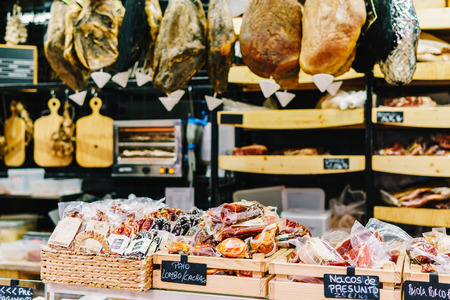 LISBON, PORTUGAL - AUGUST 11, 2017: Vendors Selling Ham, Bacon And Meat Products In One Of The Largest Market Places In Lisbon.のeditorial素材
