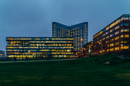 AMSTERDAM, NETHERLANDS - NOVEMBER 08, 2017: Busy Office Buildings During Night In Amsterdam Cityのeditorial素材