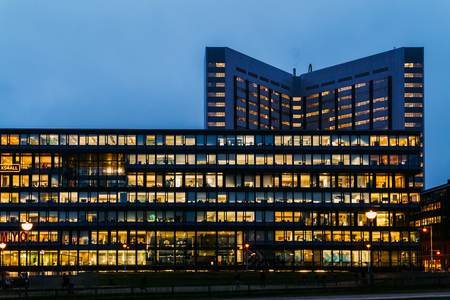 AMSTERDAM, NETHERLANDS - NOVEMBER 08, 2017: Busy Office Buildings During Night In Amsterdam Cityのeditorial素材