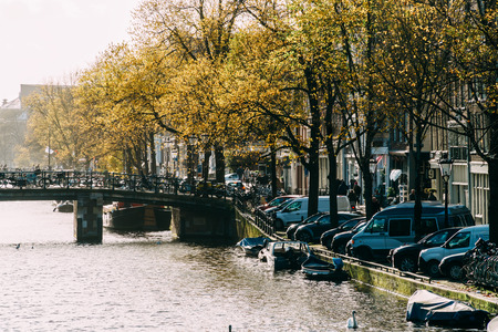 AMSTERDAM, NETHERLANDS - NOVEMBER 09, 2017: Common Dutch Houses and Houseboats On Amsterdam Canal In Autumnのeditorial素材