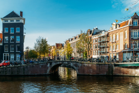 AMSTERDAM, NETHERLANDS - NOVEMBER 13, 2017: Beautiful Architecture Of Dutch Houses and Houseboats On Amsterdam Canal In Autumnのeditorial素材