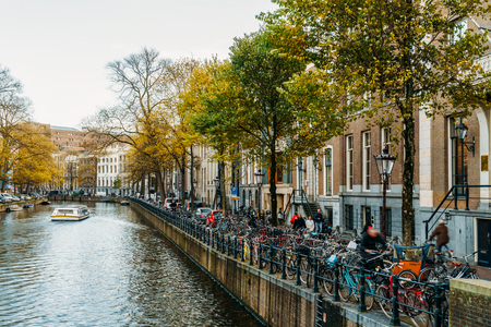 AMSTERDAM, NETHERLANDS - NOVEMBER 13, 2017: Beautiful Architecture Of Dutch Houses and Houseboats On Amsterdam Canal In Autumnのeditorial素材