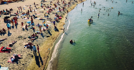 COSTINESTI, ROMANIA - JULY 15, 2018: Aerial View From Flying Drone Of People Crowd Relaxing On Costinesti Beach In Romaniaのeditorial素材