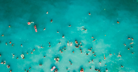 Aerial View From Flying Drone Of People Crowd Having Fun, Playing And Relaxing In Water At The Black Sea In Romaniaの写真素材