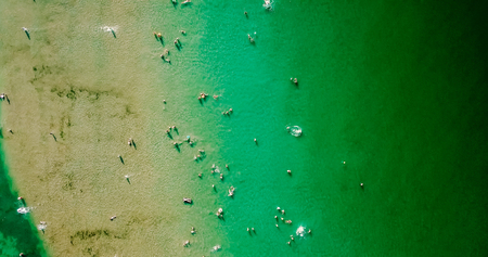 Aerial View From Flying Drone Of People Crowd Having Fun, Playing And Relaxing In Water At The Black Sea In Romaniaの写真素材