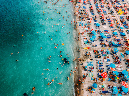 COSTINESTI, ROMANIA - JULY 16, 2018: Aerial Drone View Of People Crowd Having Fun And Relaxing On...