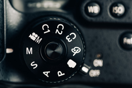 Digital Camera Control Dial Showing Aperture, Shutter Speed, Manual and Program Generic Modesの写真素材