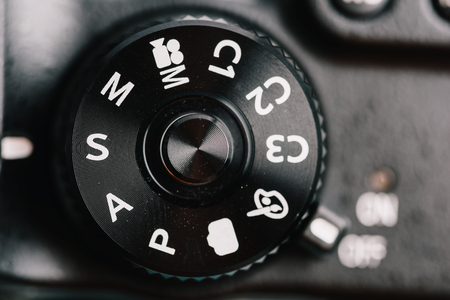 Digital Camera Control Dial Showing Aperture, Shutter Speed, Manual and Program Generic Modesの写真素材