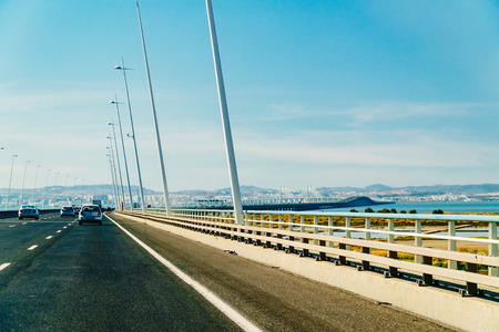 LISBON, PORTUGAL - SEPTEMBER 02, 2017: Traveling By Car To Lisbon City On Vasco Da Gama Bridgeのeditorial素材