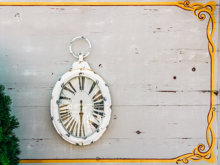 White Antique Clock On Wood Wallの写真素材