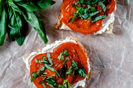Tomato And Ricotta On Toast With Fresh Basilの写真素材