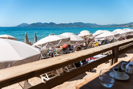 CANNES, FRANCE - JUNE 01, 2019: People On Cannes City Beach At The Mediterranean Seaのeditorial素材