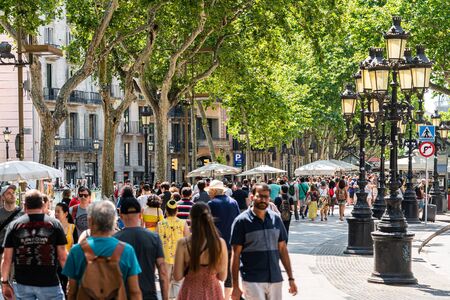 BARCELONA, SPAIN - JUNE 03, 2019: Crowd Of People And Central Downtown Barcelona City On La Rambla...