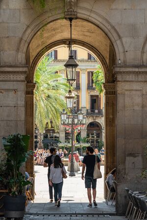 BARCELONA, SPAIN - JUNE 03, 2019: People Heading Towards Royal Square (Placa Reial or Plaza Real) a Well-Known Tourist Attraction Of Barcelonaのeditorial素材