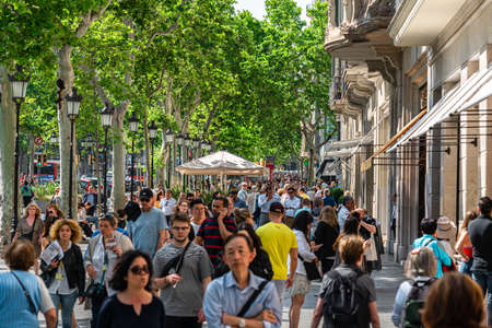 BARCELONA, SPAIN - JUNE 06, 2019: People and tourists walking on one of the most important avenues in downtown Barcelona cityのeditorial素材