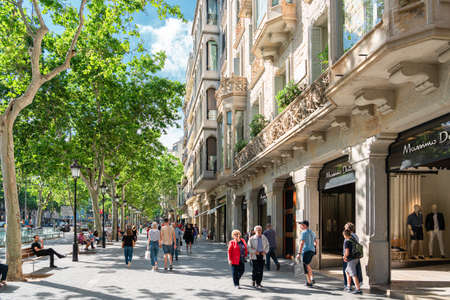 BARCELONA, SPAIN - JUNE 06, 2019: People and tourists walking on one of the most important avenues in downtown Barcelona cityのeditorial素材
