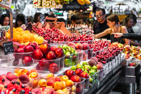 BARCELONA, SPAIN - JUNE 06, 2019: Healthy Fresh And Dried Fruits And Spices For Sale In Fruit Market La Boqueriaのeditorial素材