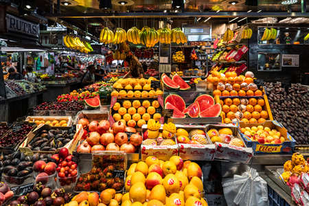 BARCELONA, SPAIN - JUNE 06, 2019: Healthy Fresh And Dried Fruits And Spices For Sale In Fruit Market La Boqueriaのeditorial素材