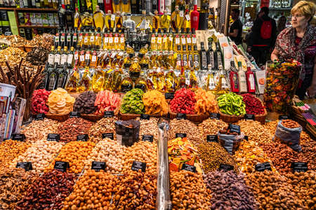 BARCELONA, SPAIN - JUNE 06, 2019: Healthy Fresh And Dried Fruits And Spices For Sale In Fruit Market La Boqueriaのeditorial素材