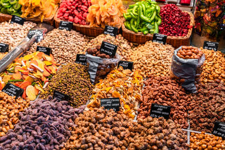 BARCELONA, SPAIN - JUNE 06, 2019: Healthy Fresh And Dried Fruits And Spices For Sale In Fruit Market La Boqueriaのeditorial素材
